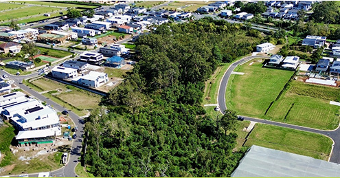 Aerial view of a residential rehabilitation offset site and surrounding waterways