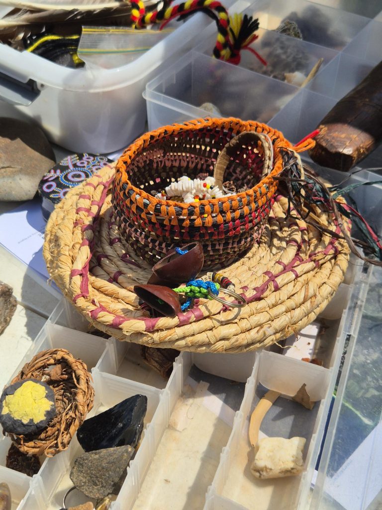 Traditional woven baskets and cultural heritage artefacts displayed for learning